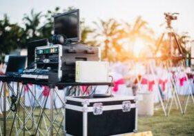 Image of an event with musical equipment in teh foreground.