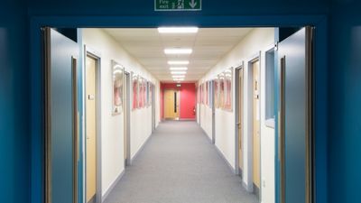 Corridor with a fire safety door at the end.